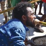 A-man-from-Makira-Ulawa-province-having-a-taste-of-the-well-known-six-months-pudding