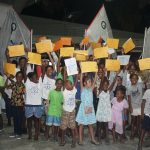 SISA junior sailors hoist their certificates during the presentation on Saturday night at the PCYC.