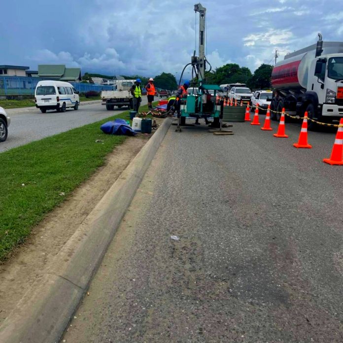 Engineers conducting drilling works for the sewer main line project.