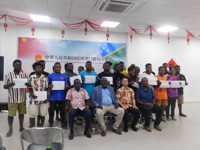 Chinese Scholarship recipients with SI Ambassador to China HE Barret Salato(left from front row)Minister of Education Hon Tozen Leokana, Charge d' Affaires Ding Yonghua