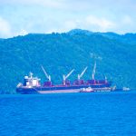 A ship loading grounds mix wth minerals ready for export