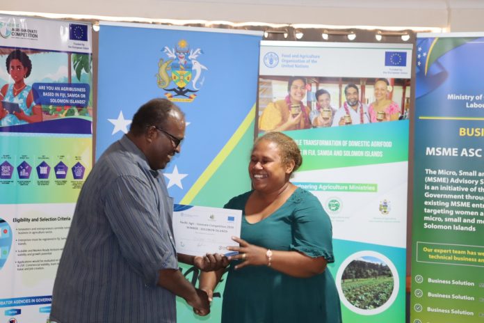 Susan Timi(right) receiving her certificate photo credit BAF