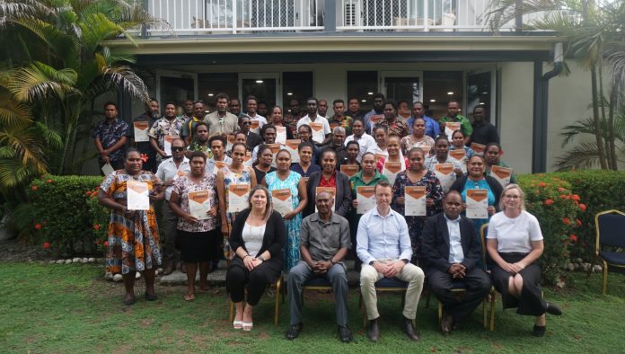 Group photo of staff from the Ministry of Public Service, PS Luke Cheka, trainers, and DFAT reps.