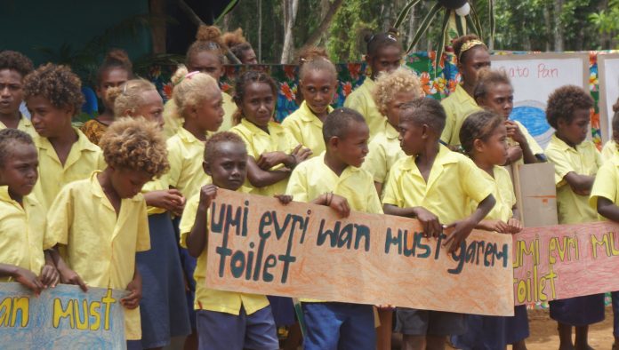 Students with posters about to present a poem