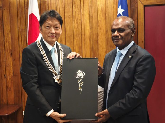 Prime Minister Jeremiah Manele, MP, and Japanese Ambassador to Solomon Islands, Higuchi Keiichi during the exchange of gifts at the Office of the Prime Minister and Cabinet.