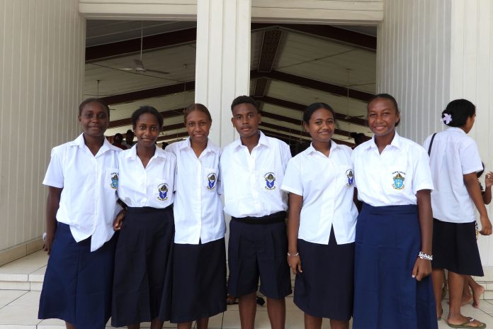 Students of ST Nicholas & Selwyn College pose for a photo after the service