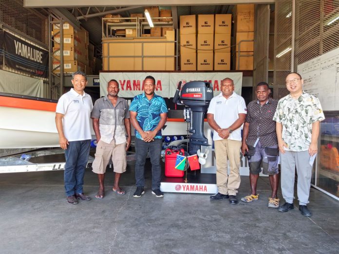 Representatives from the Chinese Embassy. Temotu Nende Constituecy and Y.Sato Marine pose for a group photo with tbe boat and engine during the handover last Thursday.