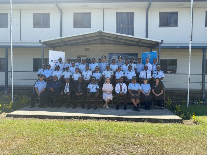 A group photo of the 22 police officers, RSIPF senior officers and officials from the Australian High Commission.