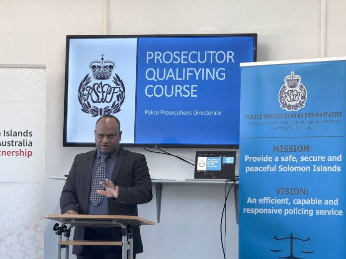 Andrew Kelesi, Director of Public Prosecutions speaking to the police officers.