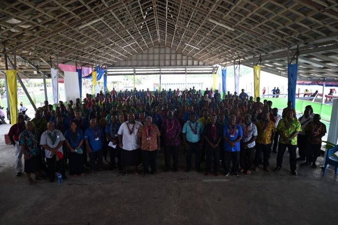 Guests and officials pose for a group photo after the official opening program