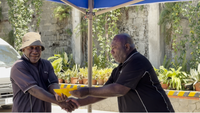 Ron Black, HR and Administration Officer at Ropiko Energy and One of the winners from the August giveaway, John Dora