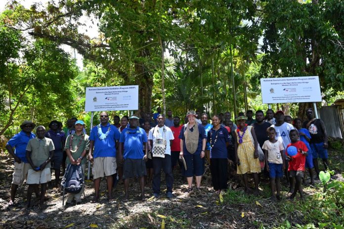 Officials and people of Niubare celebrate the achievement