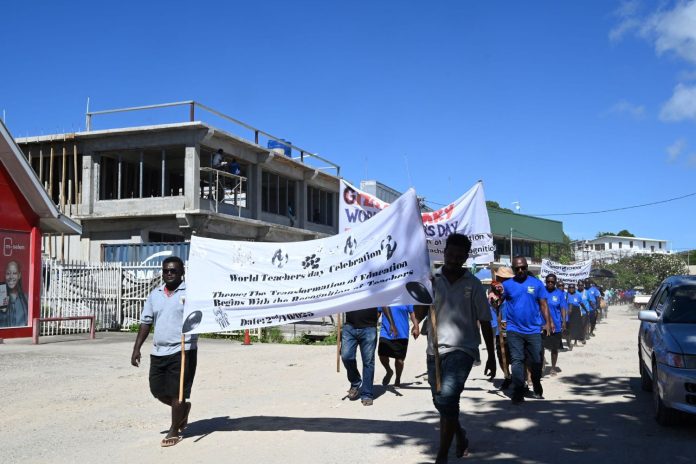 Teachers match infront of Gizo Market