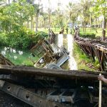 Afutara Bridge collapsed with the CCECC grader stuck in the middle. (Photo source Phlince Mauniala)