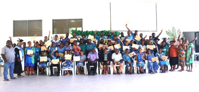 Group photo of students, staff, and guests.