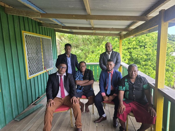 Successful motion mover Eric Sau'eha (sitting, far left) and his group after their win yesterday. Photo supplied