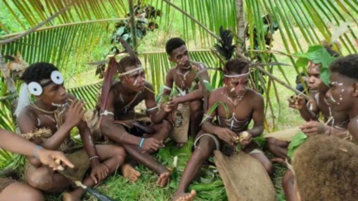 Male students dressed in traditional attire getting ready to perform at the school’s first-ever culture day event. Photo credit- Madam Danialla Geli