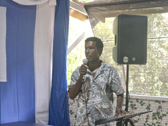Mr Willie Etupio delivers his speech