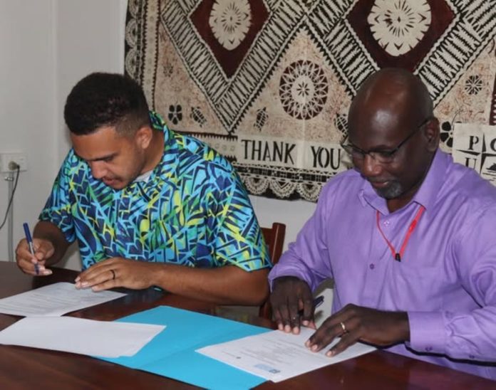Pacifiki HR director Caleb Polland & SINU Acting Vice Chancellor Associate Professor Eric Katovai Signed the MOU . Photo credit. SINU