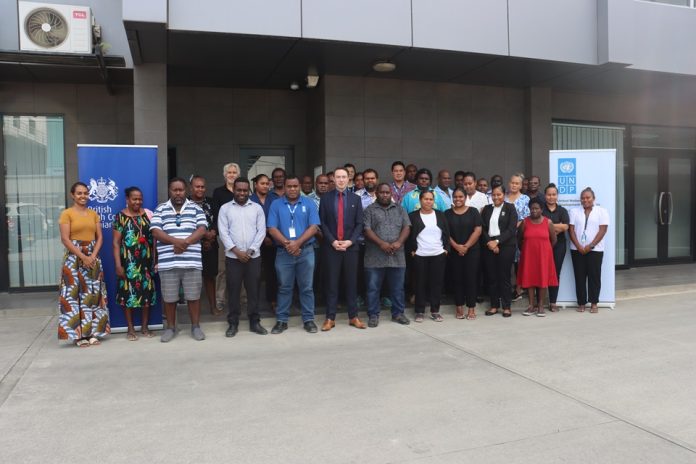 Deputy British High Commissioner, Cameron Millar (center), Acting Permanent Secretary of the Ministry of Finance and Treasury, Coswal Nelson (right) and UNDP Programme Specialist