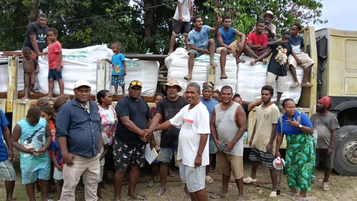 Members of East Honiara Constituency Office handover materials for Aekafo Community Footpath Project