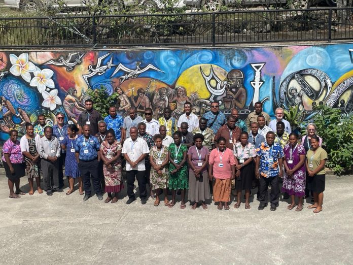 The thirty education professionals group photo right outside Rock Haven Inn. photo credit by Lore Wale. (1)